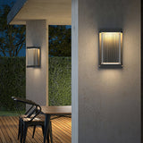Ravon | Modernist Outdoor Wall Light in Black Metal with Ribbed Shade for Courtyard and Patio Use