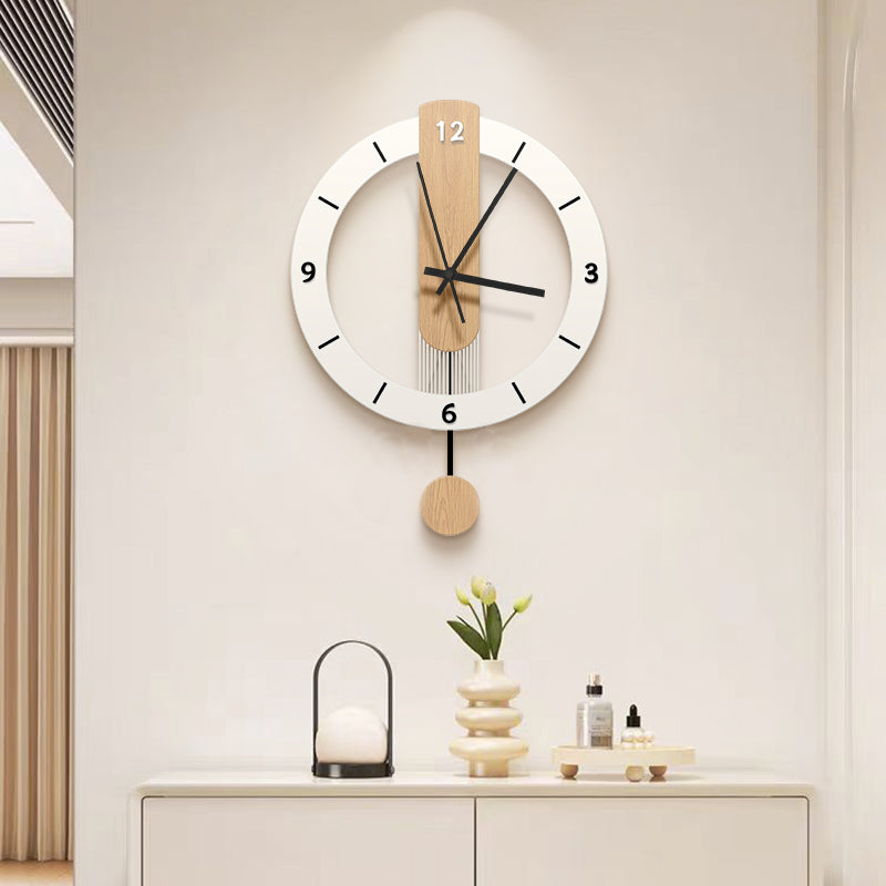 Dinah solid wood pendulum wall clock above a white sideboard