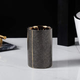 Meron | Four-Piece Ceramic Bathroom Accessory Set with Gold Trim in Matte Black and White for Sink