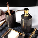 Meron | Four-Piece Ceramic Bathroom Accessory Set with Gold Trim in Matte Black and White for Sink