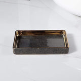 Meron | Four-Piece Ceramic Bathroom Accessory Set with Gold Trim in Matte Black and White for Sink