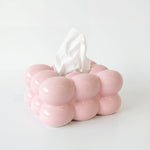 Hollis pink ceramic bubble tissue box with a white tissue drawn through the top opening