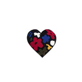 Latimer heart shaped embroidered cushion with colourful floral tufting on black fabric