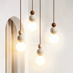 Minimalist Spherical Pendant Light with Natural Accents 1