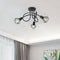 Penhurst industrial black iron ceiling light with three wire cage shades mounted on a white ceiling