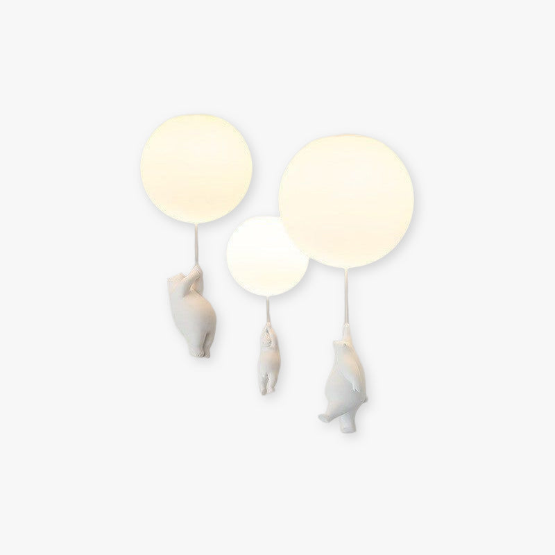 Yorick bear and balloon LED ceiling light glowing against a white wall