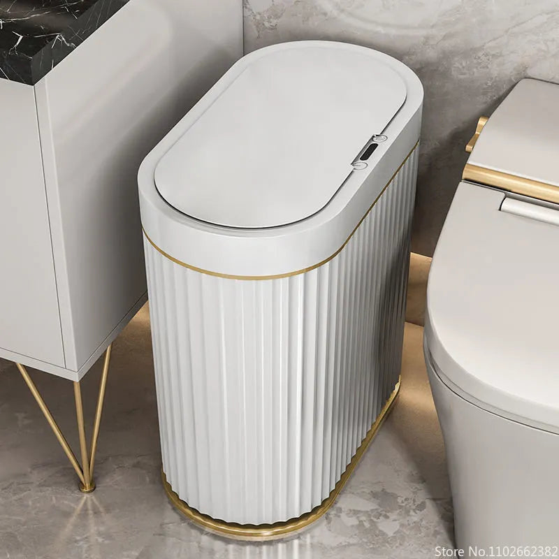 Fairfax touchless ribbed waste bin beside a toilet in a marble bathroom