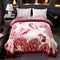 Highgate soft plush floral blanket draped over a made bed