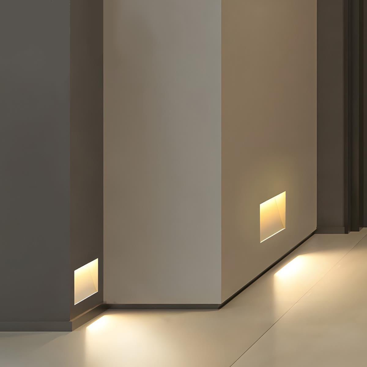 Latimer recessed LED step light glowing softly along a hallway wall at night