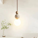 Minimalist Spherical Pendant Light with Natural Accents 2